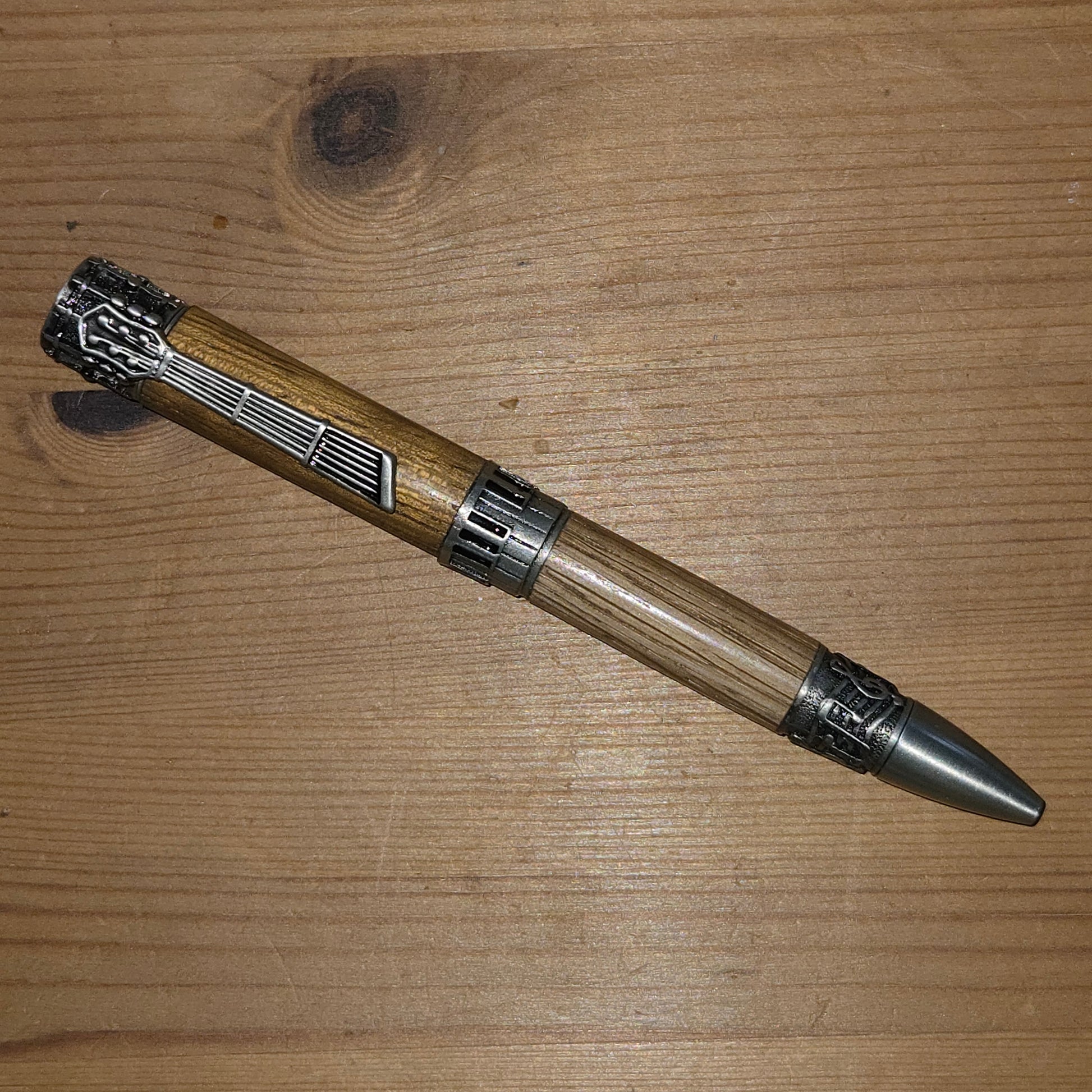 Pewter music Twist pen in walnut and oak